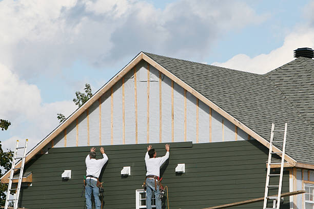 Professional Storm Damage Siding Repair technician working in Middlebury, IN